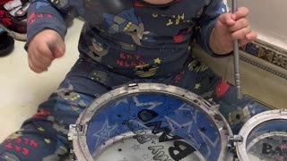 The baby drummer is very cute