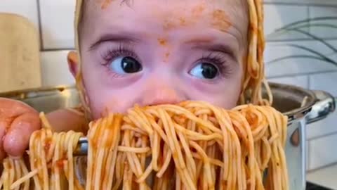 baby taking a pasta bath