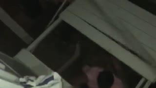 Guy falls through roof pink shirt