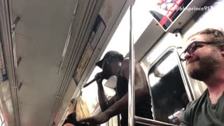 Guy singing over cardi b on subway train