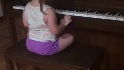Little Girl playing on the Piano funny