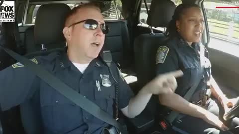 Boston police officers belt out patriotic song