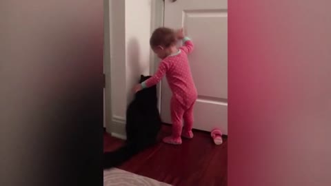 Watch the cat help the child open the door