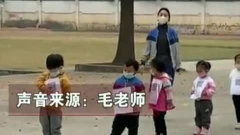 Chinese kindergarteners with QR codes hung around their necks in queue for COVID testing