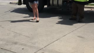 Woman Spits on City Workers at Gas Station