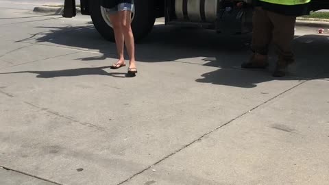 Woman Spits on City Workers at Gas Station