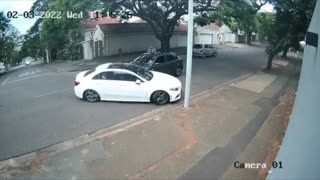 Urban Defence private security chasing suspects through a suburb