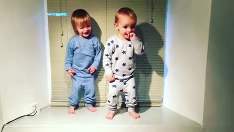 Unbelievably cute twins dance to hip hop track.