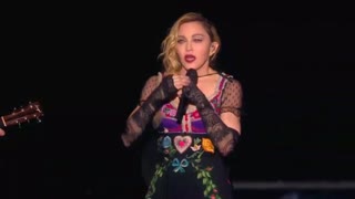 Madonna pays teary tribute to Paris victims at gig