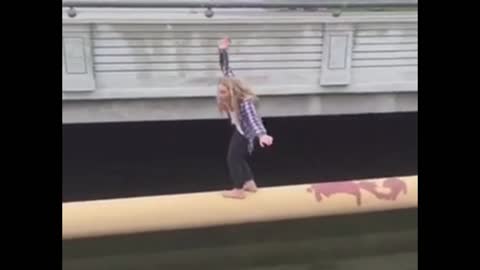 Twerking girl falls off a bridge