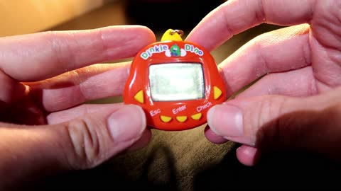 Trying out an old Dinkie Dino Toy (handheld virtual pet)
