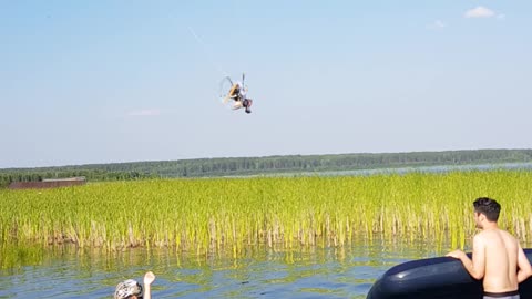 a man takes off on a paraglider