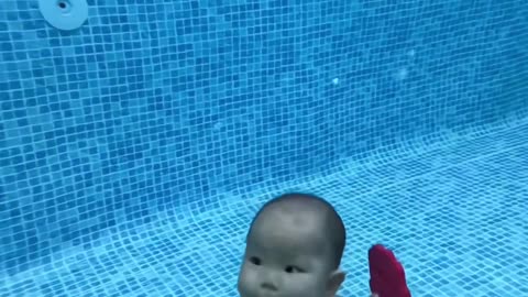 Little Baby Swimming In Pool