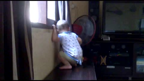 Baby dances out the window.