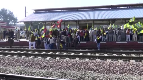 Protesting Indian farmers occupy railroad tracks