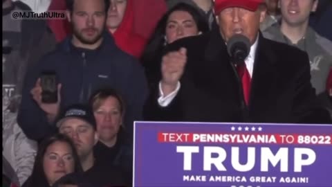 Man Behind Trump Flashes Q at Rally