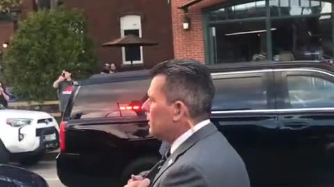 Trump gets out of vehicle in Atlanta.