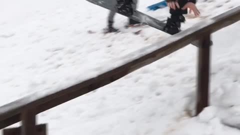 Guy kid in red jacket snowboard jump misses rail and slams face onto rail