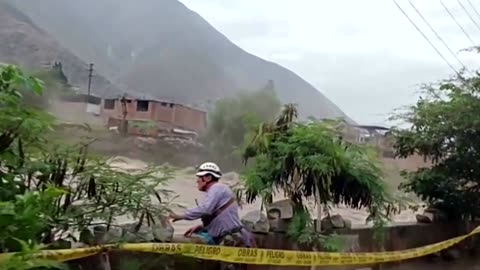 House collapses into Peru river after heavy rain