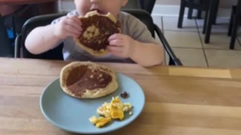 Toddler adorably eats mom's better tasting food