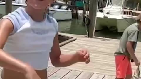 Forget sharks, this little girl was feeding a giant tarpon in Florida