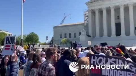 Hundreds protest at the US Supreme Court, as they weigh in on a ban for sleeping outdoors