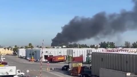 The plume of hazardous black smoke from the Medley, Florida “random” industrial explosion
