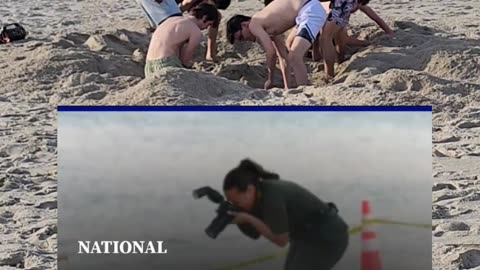 Digging Holes in the Sand at the Beach