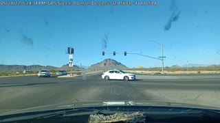 Car Does Doughnuts Through Traffic Intersection