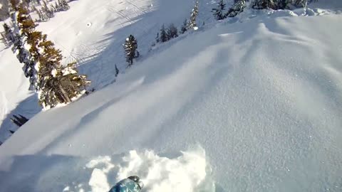 Daredevil Snowboarder Has Close Encounter With Mini Avalanche