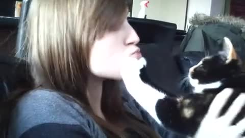 Girl Trying To Kiss The Cat