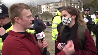 Masked up communist telling Callum from rebel news UK that the people are "far right"