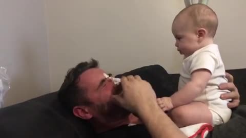 Baby throws up on dad