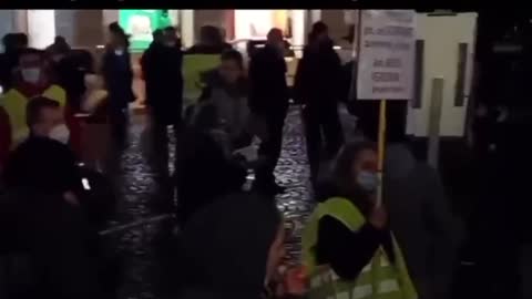 German Police measure the distance between citizens in Town Square