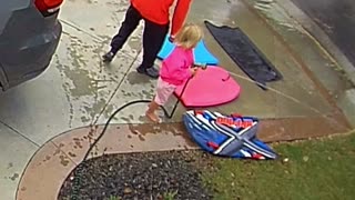 Daughter Gets Dad With Water Hose