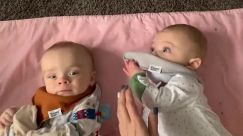Baby steals twin brother's pacifier right from his mouth