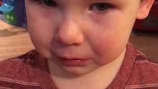 toddler resists against spaghetti for dinner