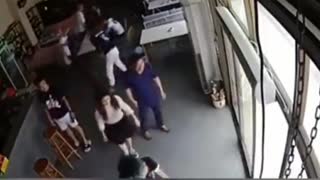 Man hits a door and causes it to fall down
