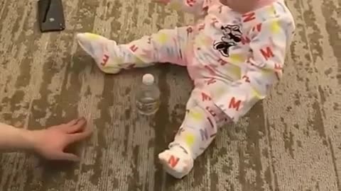 This baby does an epic bottle flip