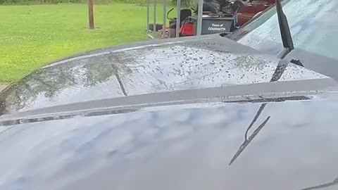 High-pressure hair dryer cleans water droplets from washed cars.