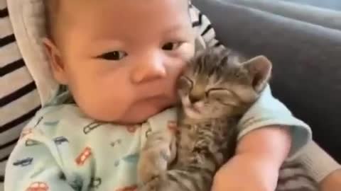 Baby and cat sleeping