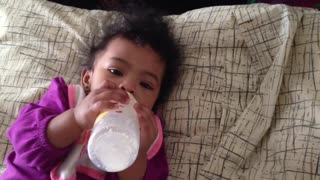 Blasian Baby Sister Bottle Feeds Herself