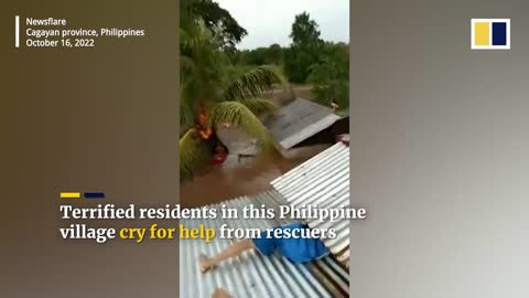 Terrified residents cry for help from roofs of flooded houses in Philippines