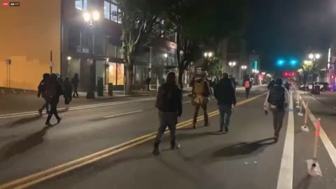 Portland antifa harass police cruiser.