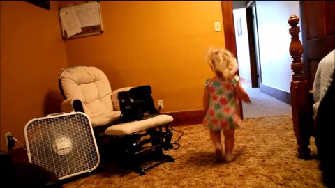 Crazy toddler screams each time she runs through fan