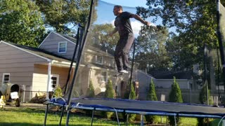 50 year old dad schools kids on trampoline