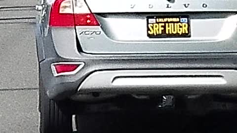 Car license plate reads "srf hugr"