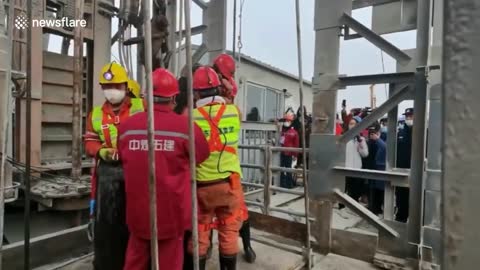 Rescuers haul 11 of 22 trapped Chinese miners from gold mine