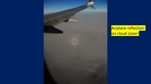 Airplane reflection on clouds with halo!