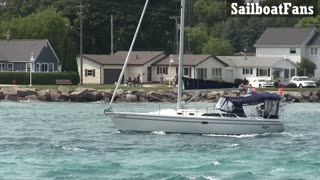 Pazzo Sailboat Cruising Down St Clair River In Great Lakes